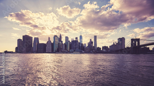 Manhattan skyline silhouette at sunset  color toning applied  NYC.