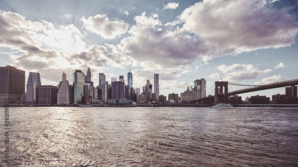 New York City skyline at sunset, color toning applied, USA.