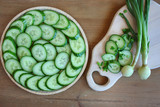 Light sandwiches with cheese, a tray with slices of fresh cucumber, onion, dill