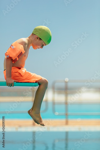фотографія Boy afraid of diving in the pool