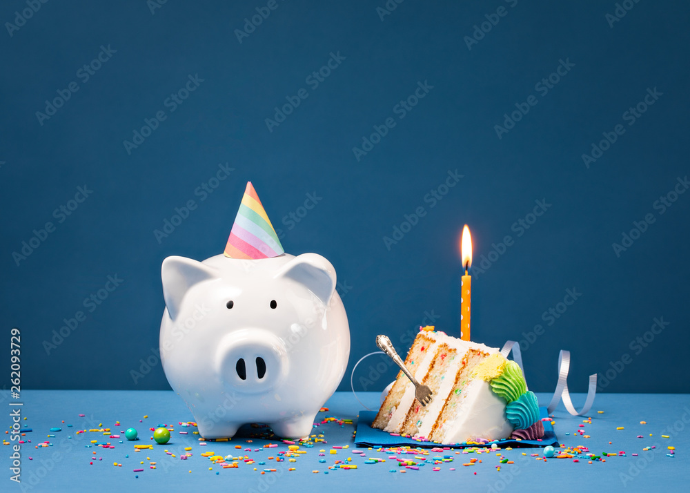 Slice of Birthday Cake with Piggy Bank - obrazy, fototapety, plakaty 