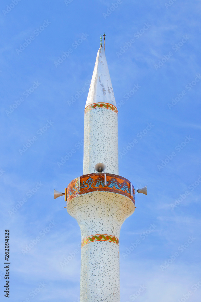 Amazing white tower of the minaret belonging to the islamic mosque in  Cypriot Dipkarpaz, Northern Cyprus. The Turkish part of Cyprus is  predominantly of Muslim religion. Stock Photo | Adobe Stock
