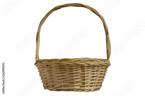 Wicker basket with handle on white background. Isolated object. Basket for gifts, flowers and fruit.
