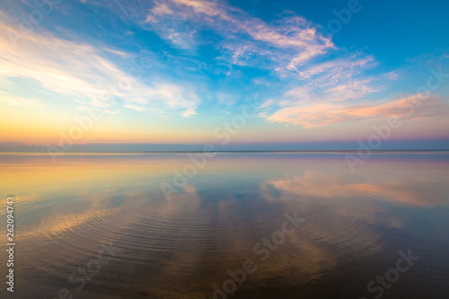 Seascape with colorful evening sky. Natural background. Beautiful sunset over the sea in the Atlantic ocean.