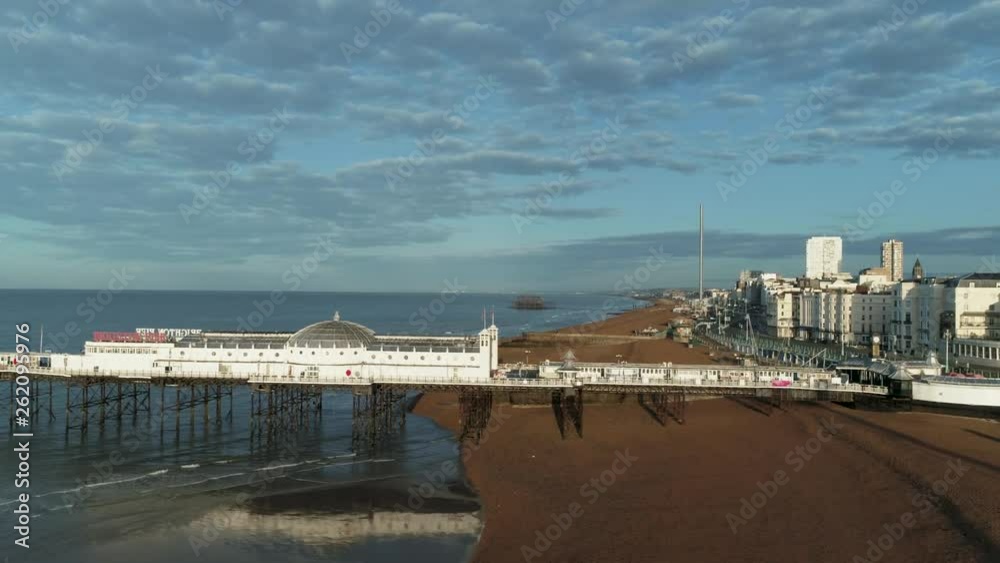 Aerial dolly view of the pier in Brighton after sunrise Aerial dolly view of the pier in Brighton after sunrise