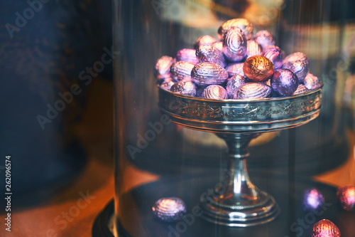 Traditional colorful Easter chocolate eggs in a confectionery storefront in Brussels, Belgium