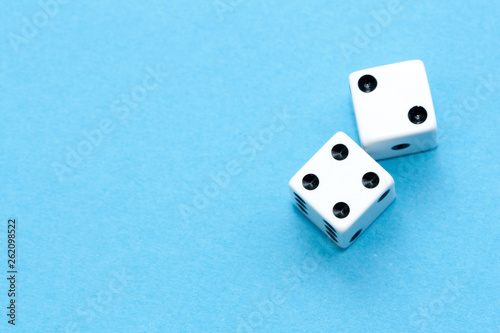 Gaming dices on blue background.