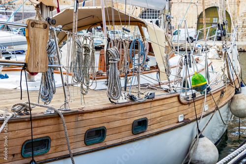 Ropes and buoys hanging off the side of a sailing boat at Vittoriosa Yacht Marina in Malta