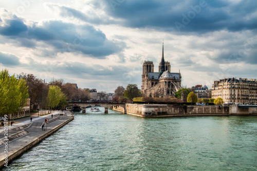 Notre Dame Cathedral during a Cloudy day with Seine River in Foreground, Paris © romanslavik.com