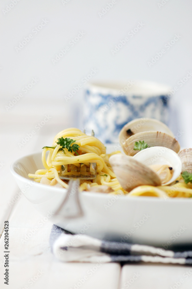 Fork in bowl of spaghetti and clams Fork in bowl of spaghetti and clams