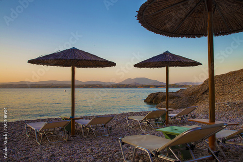 Beautiful   sunset on Spetses   and  authentic straw umbrellas