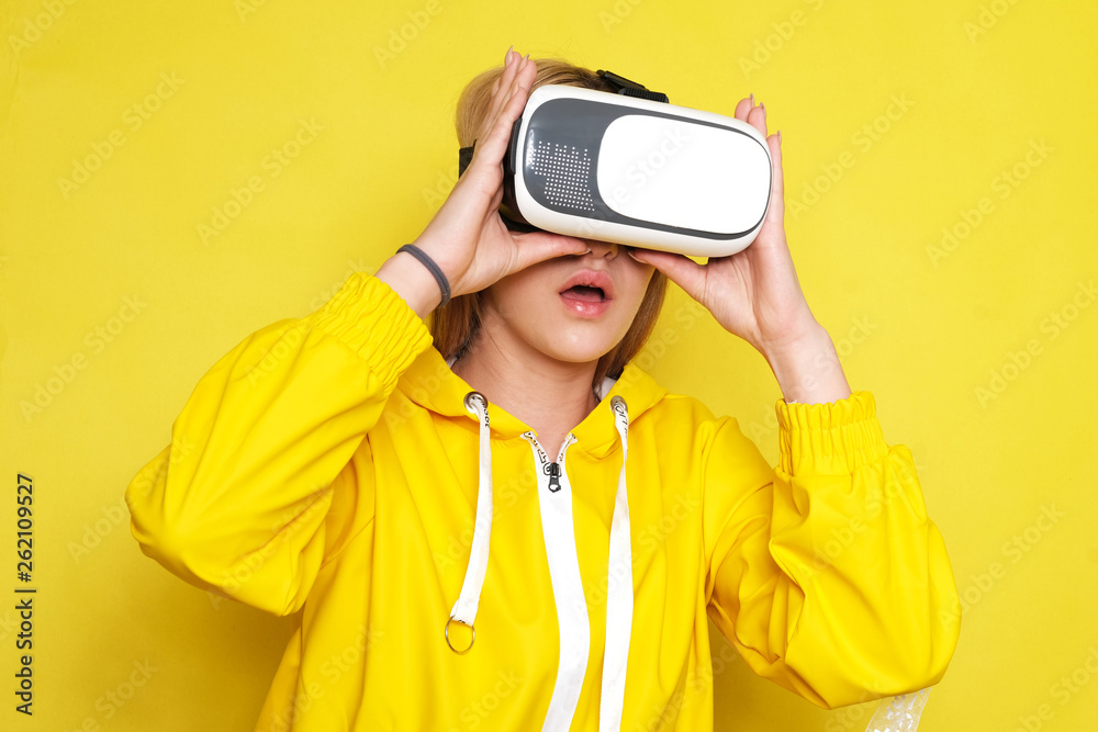 Woman wearing VR goggles. Full of expression.