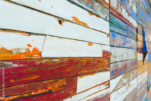 Painted wooden boards of various colors aged, natural texture background.