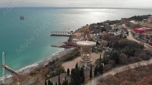 Radio telescope RT-22 in Simeiz Observatory, Crimea. Big white satellite dish antenna on sea coast for astronomy research, aerial view photo