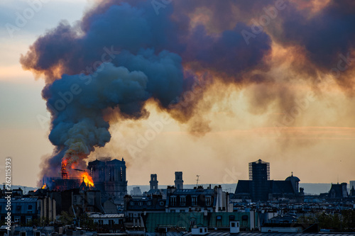 Notre Dame fire on Paris during sunset