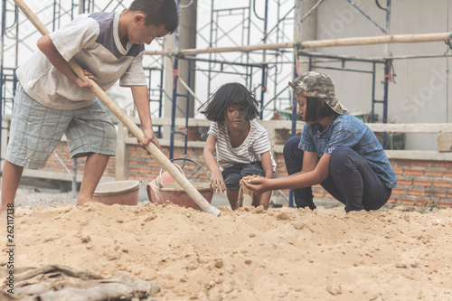 Children working at construction site for world day against child labour concept: