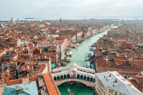 Aerial panoramic view of famous Canal Grande and famous Rialto Bridge at suns...