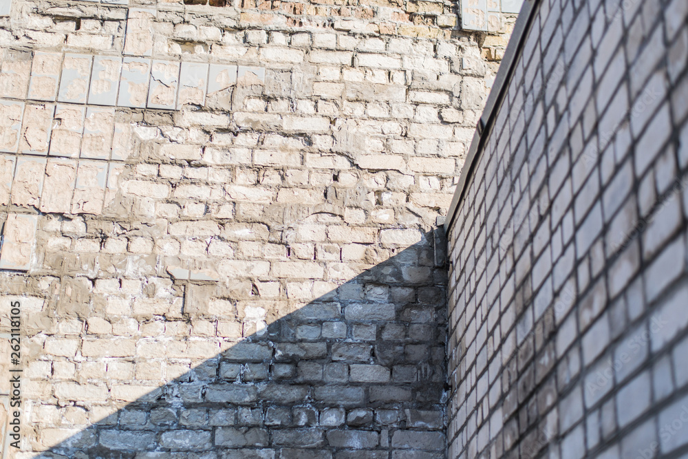 The wall of the building with collapsed tiles. The wall of the building with collapsed tiles.