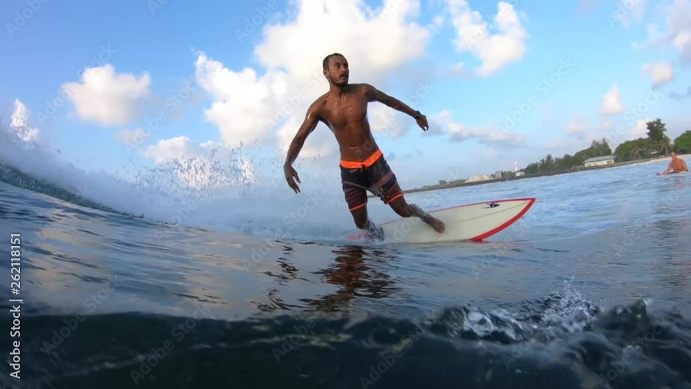 Maldivian surfer rides the ocean tropical wave. Clip contains underwater view of the surfer Maldivian surfer rides the ocean tropical wave. Clip contains underwater view of the surfer