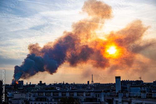 Notre Dame burning during sunset, Paris
