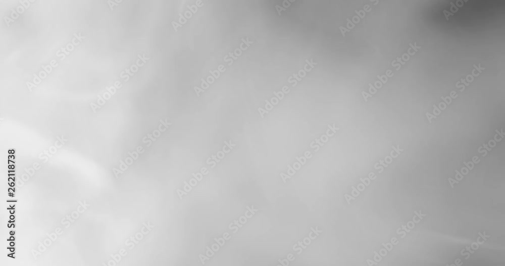 White smoke floating through space against black background White smoke floating through space against black background
