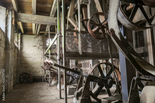 Engines in basement of belt driven grist mill photo