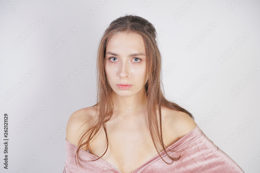 cute young caucasian girl is sad on white background in Studio cute young caucasian girl is sad on white background in Studio