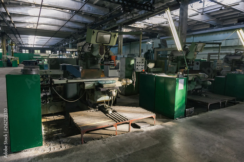 Old metalworking factory production line. Rusty machine tools