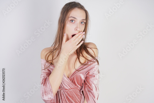 cute caucasian teen girl is surprised on white background in Studio