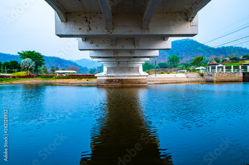 Thachompoo bridge or white bridge with country view in Lamphun province photo