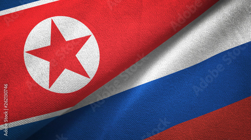 North Korea and Russia two flags textile cloth, fabric texture photo