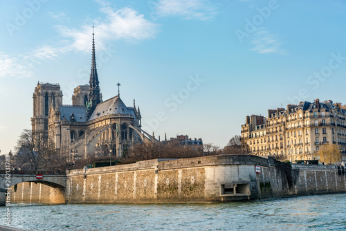 Panoramic view of the Notre Dame de Paris cathedral on its backside on the banks of the Seine