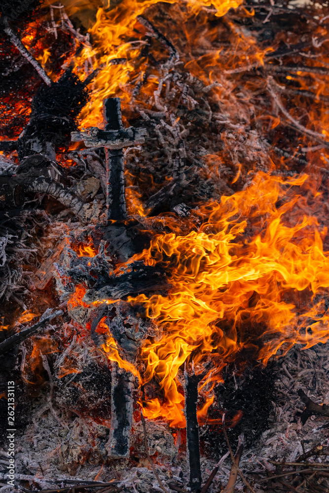 Flaming fire. Burning tree branches. Pagan rite dedicated to the arrival of spring. Big bonfire on Shrovetide. Flaming fire. Burning tree branches. Pagan rite dedicated to the arrival of spring. Big bonfire on Shrovetide.