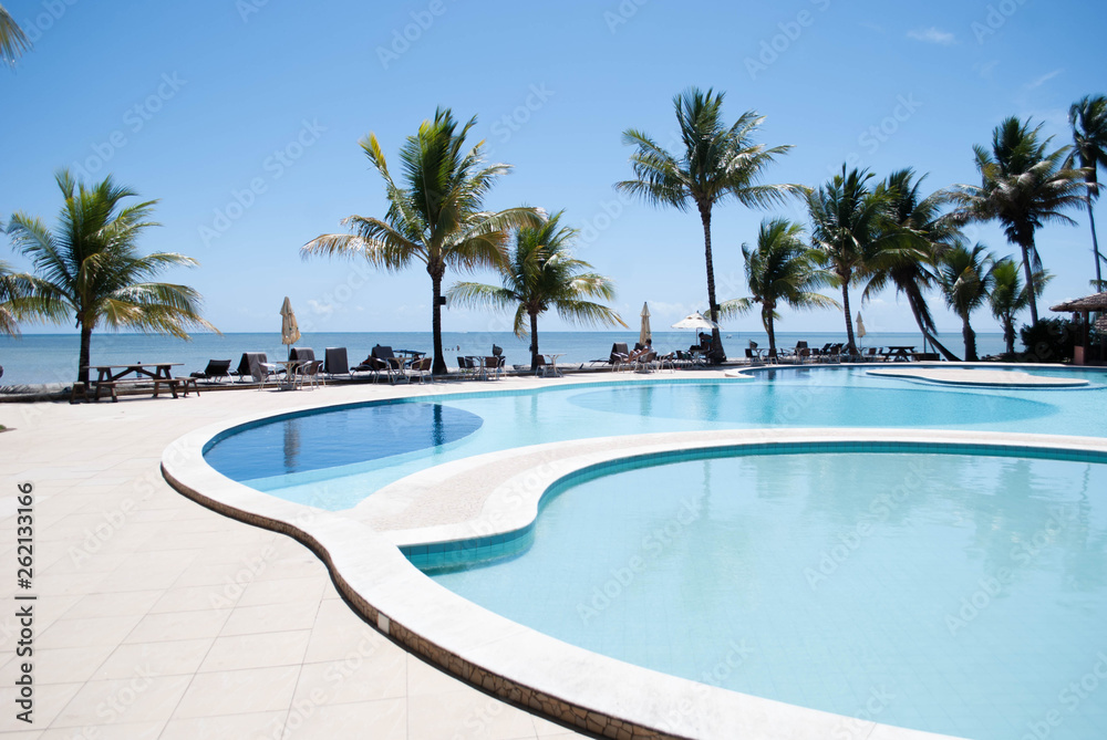 Fototapeta premium Beautiful blue swimming pool on the beach