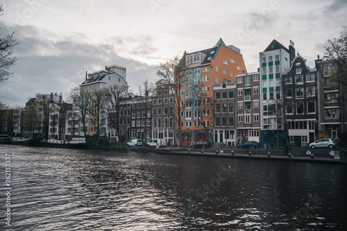 Cozy european architecture with river canal. Amsterdam beautiful houses