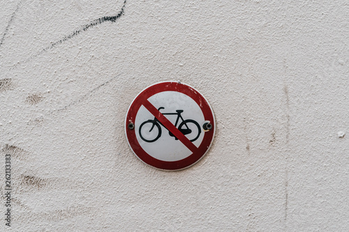 Road sign on wall. No bikes