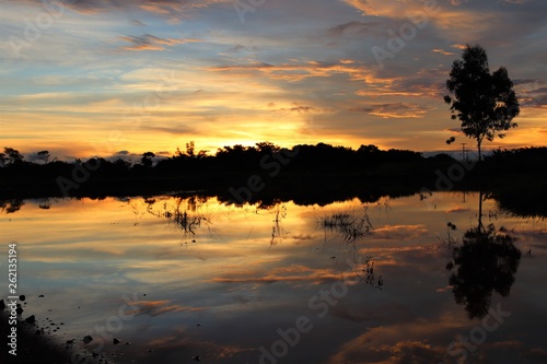 Skylight and clouds reflected in a lake at sunset