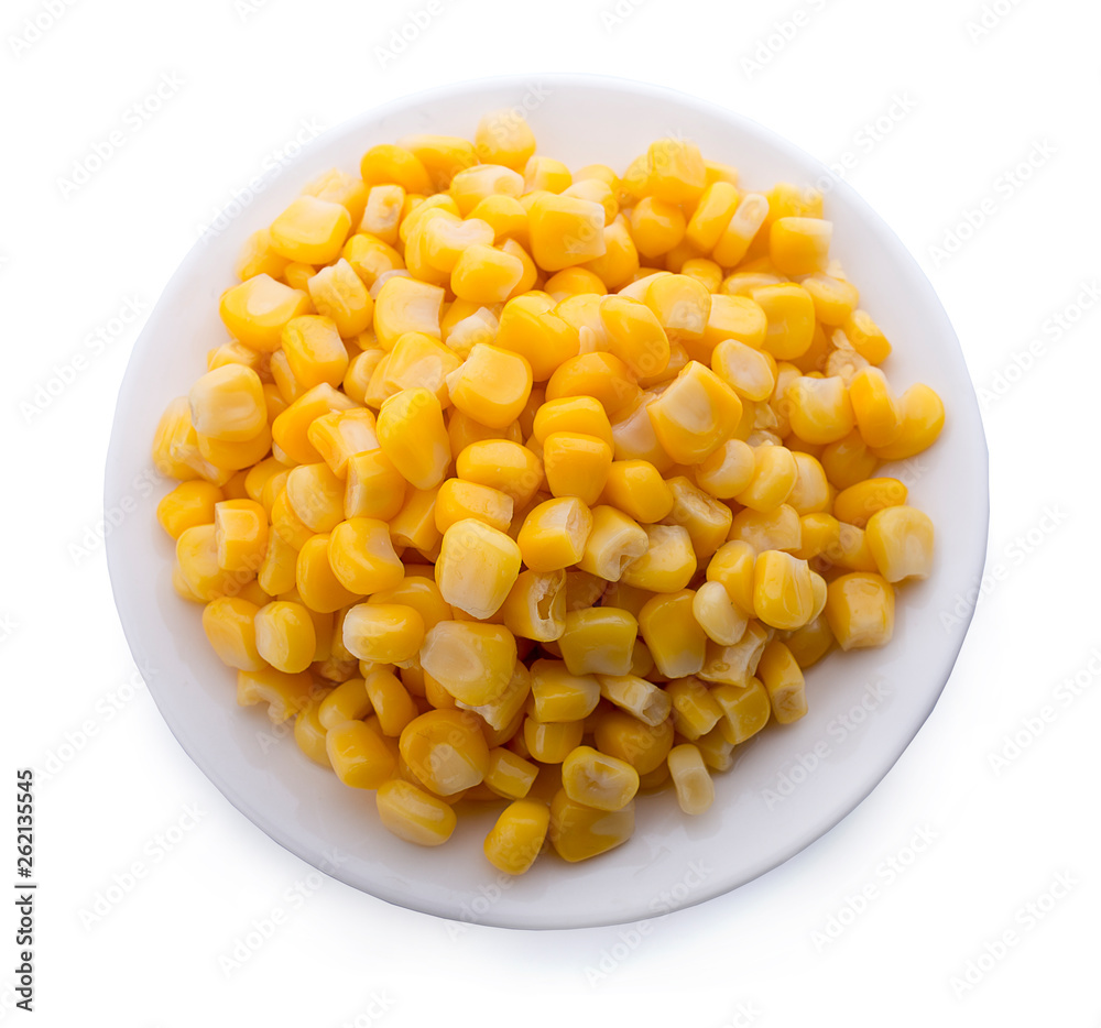 Corn on a white plate isolated on white. Top view. Corn on a white plate isolated on white. Top view.