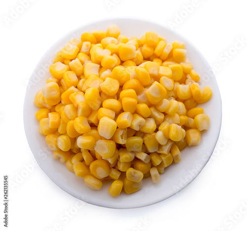 Corn on a white plate isolated on white. Top view.