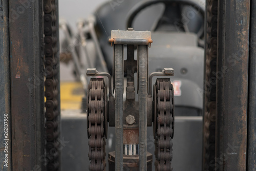 Close up forklift chain, Oiled mechanical chain on a forklift truck