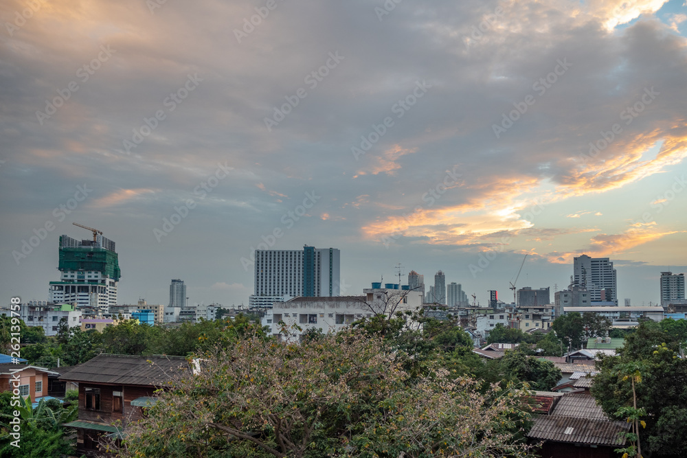 Panorama view of small town and city on cloudy sky  with evening sunlight background