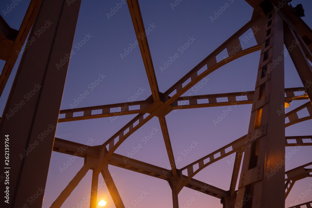 Low angle of steel bridge structure on beautiful clear twilight sky background