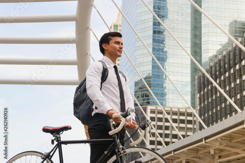 Businessman cycling to work