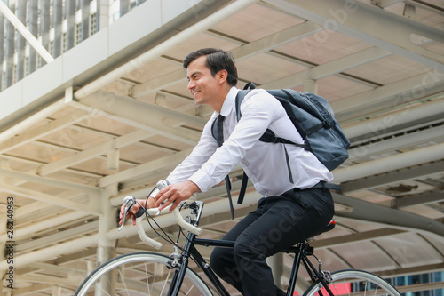 Businessman cycling to work