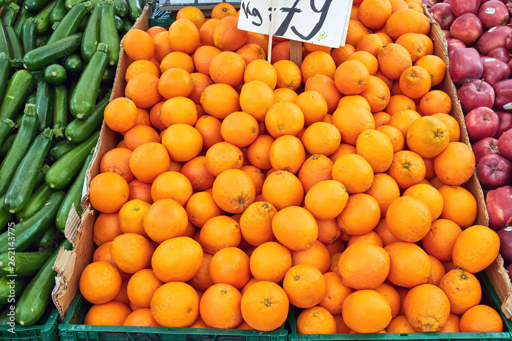 Oranges, pickles and apples for sale at a market