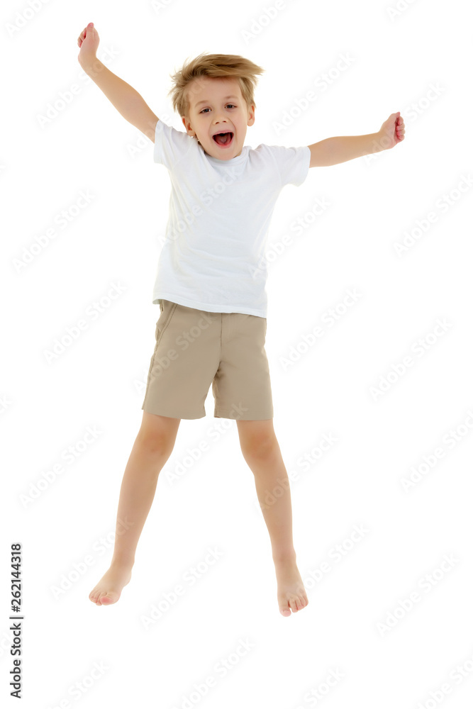 A little boy in a clean white T-shirt is jumping fun. A little boy in a clean white T-shirt is jumping fun.