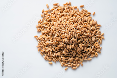 spelled wheat cereal on a white background, top view
