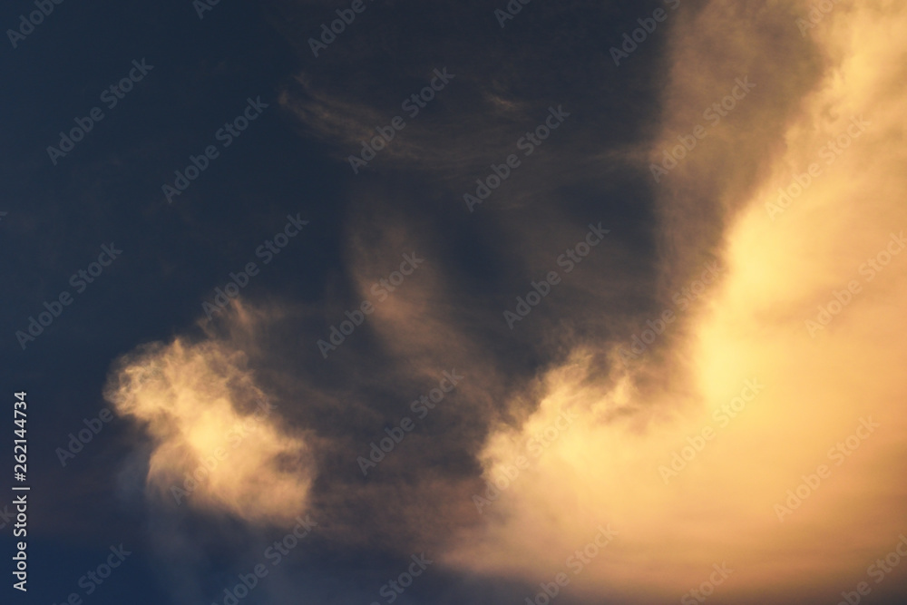 Orange color fluffy cloud at sunset , White cotton candy clouds on tropical blue sky at night, Thailand
