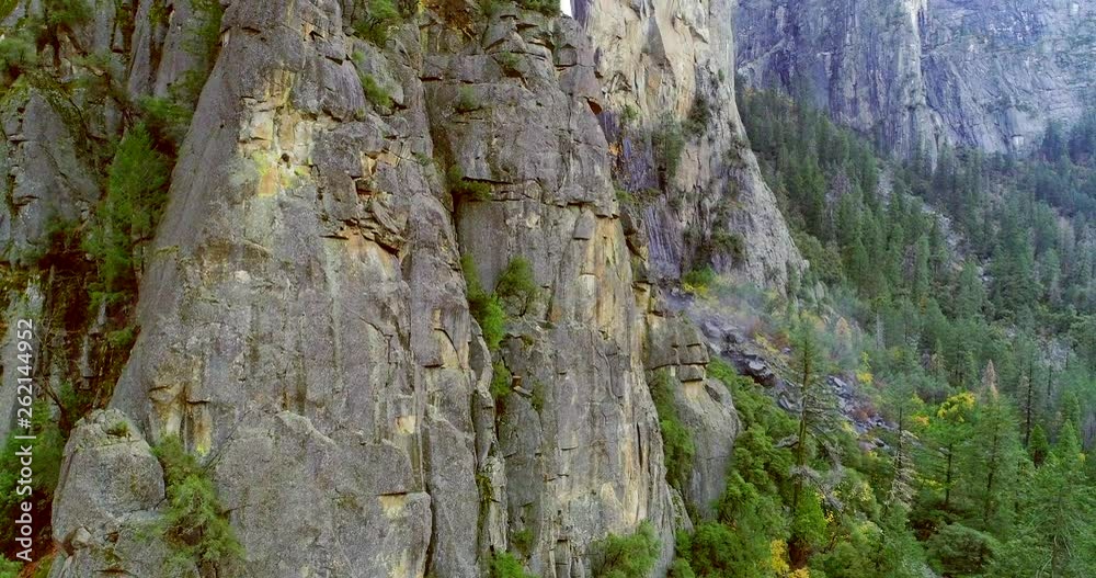 YOSEMITE NATIONAL PARK, CATHEDRAL ROCKS, CA, USA. Inspiring views of some of fascinating formations within the park. Aerial 4K shot of prominent pinnacles, cliffs and buttresses. YOSEMITE NATIONAL PARK, CATHEDRAL ROCKS, CA, USA. Inspiring views of some of fascinating formations within the park. Aerial 4K shot of prominent pinnacles, cliffs and buttresses.