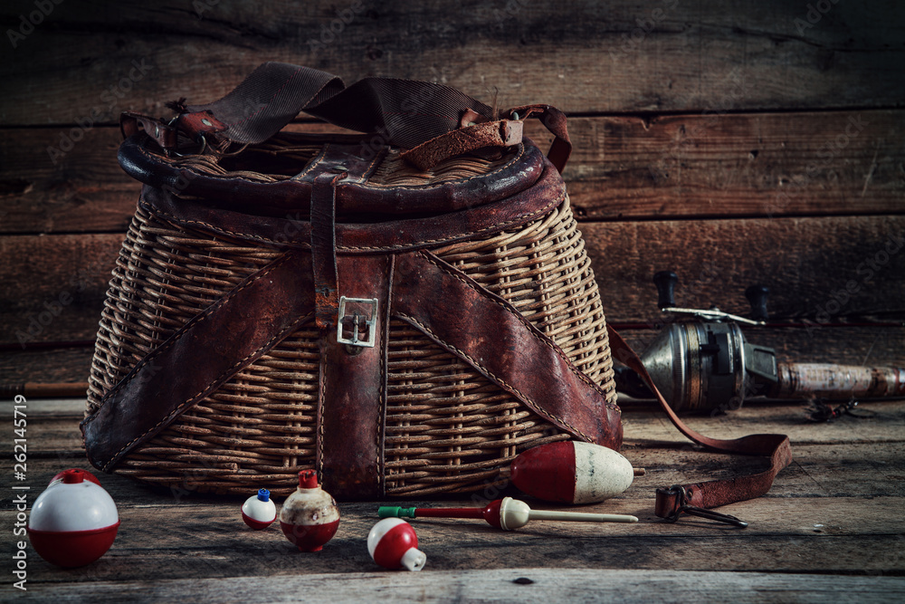 Fishing bobbers with vintage Creel basket Stock Photo